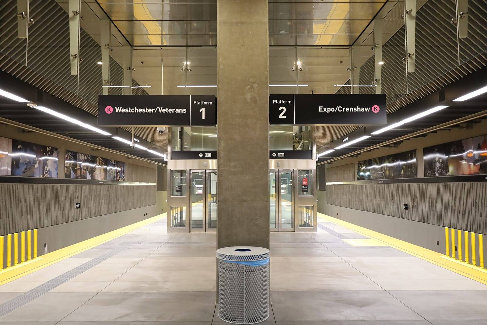 Underground platform at Metro Leimert Park station with signs for the K Line toward Westchester/Veterans and Expo/Crenshaw